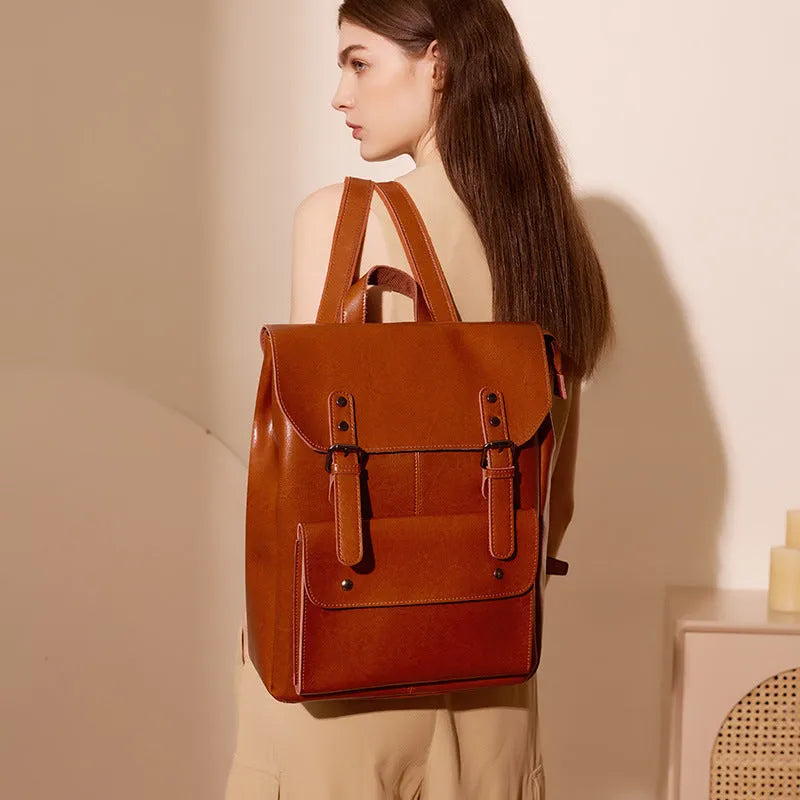 Genuine two-layer cowhide leather computer backpack for women in black, brown, or coffee.