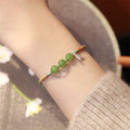 Handmade Hetian jade and chalcedony bracelet with woven strap in light green or blue colours