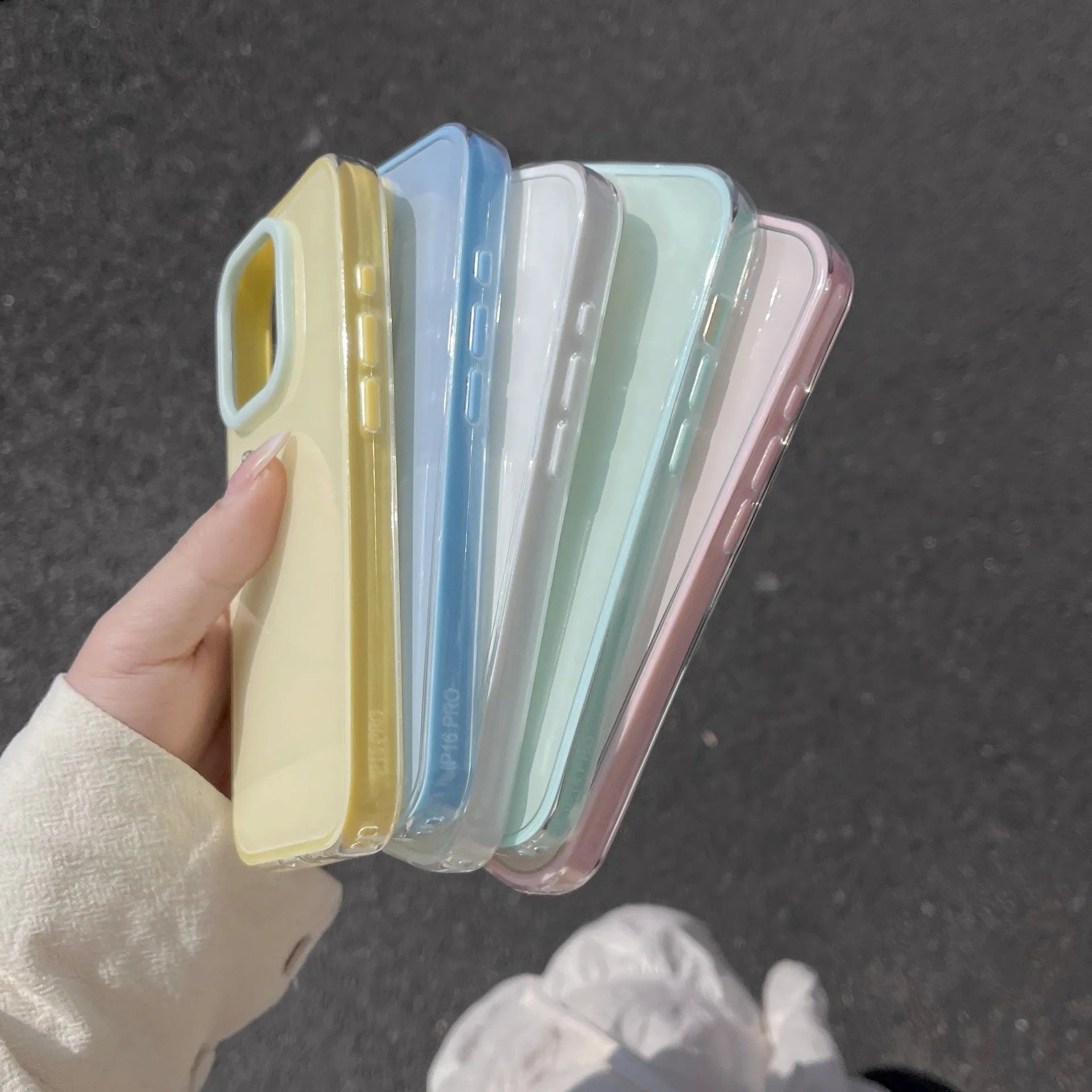 Simple solid colour jelly TPU phone case for iPhone, shown in blue, white, and yellow.