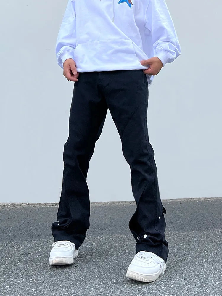 Loose cotton straight jeans for men and women in black, laid flat showing straight-leg design