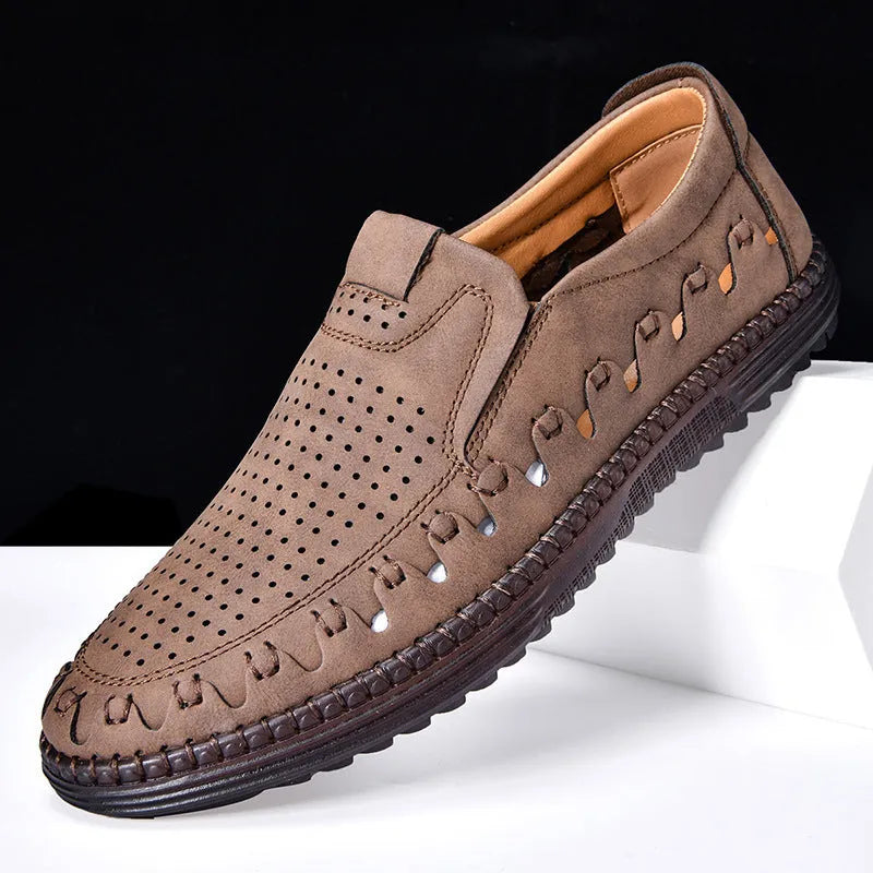 Men's brown slip-on casual shoes with round toe and hollowed-out pattern detailing
