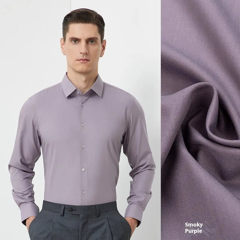 Man wearing a light blue long-sleeved non-iron business casual shirt with a regular fit.