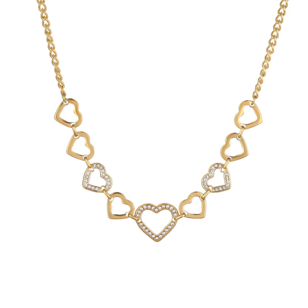 Geometric heart-shaped stainless steel pendant necklace with 18K gold finish on clavicle-length regular chain