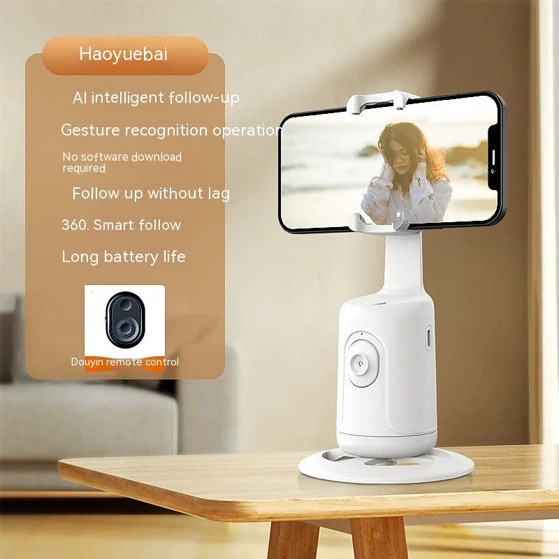 New Automatic Tracking Stabiliser with 360° rotation, ABS body, dark black colour, on a desktop with USB cable