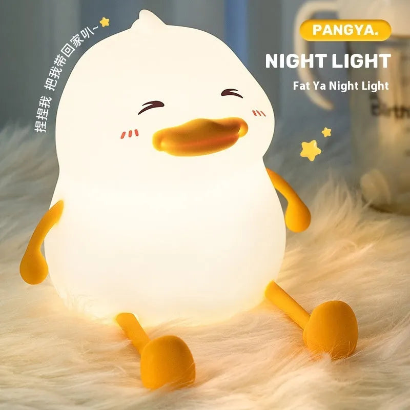 Chubby Night Light on a desk showing its compact size and silicone phone holder feature.