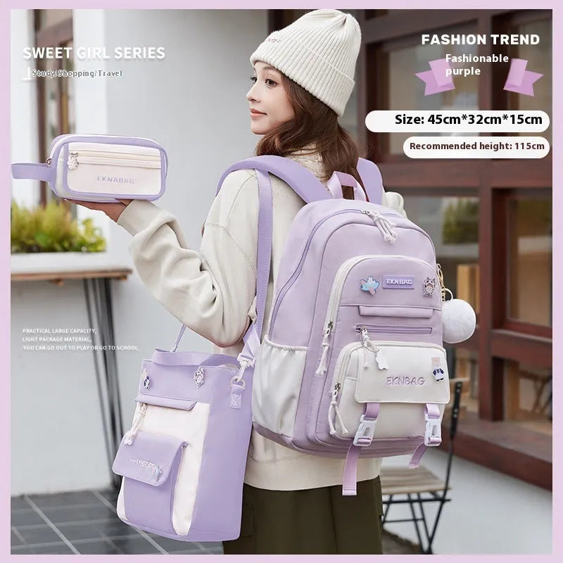 Girls' pink waterproof Oxford cloth school backpack with curved shoulder straps.