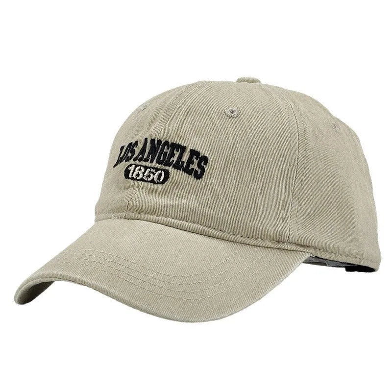 Retro personalised peaked cap with letters embroidery in beige, adjustable strap visible.