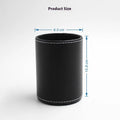 Black leather round pen container on desk with dimensions 8.0cm diameter 10.8cm height
