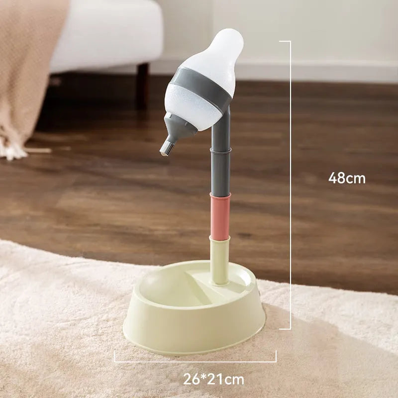 Green adjustable pet standing water dispenser with detachable pole and bowl on a grey floor.
