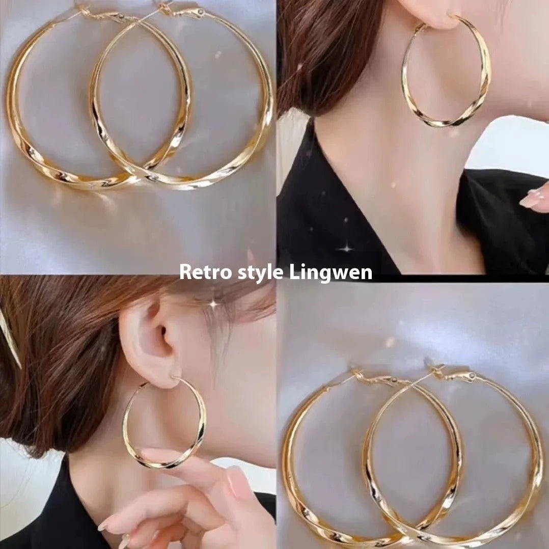 Twisted eyelet simple metal earrings in 3499 Gold and 3499 Silver on neutral background