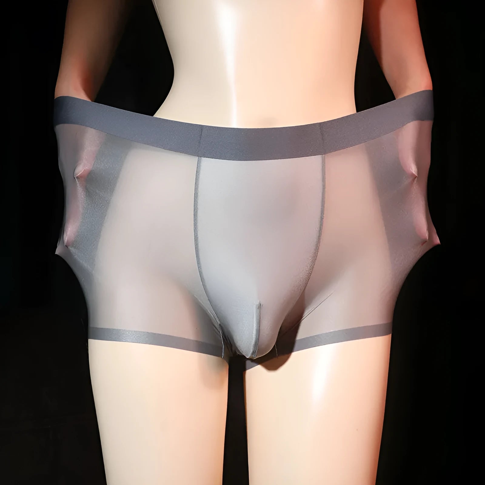 Men's ultra-thin transparent ice silk boxer shorts in light grey, shown flat.
