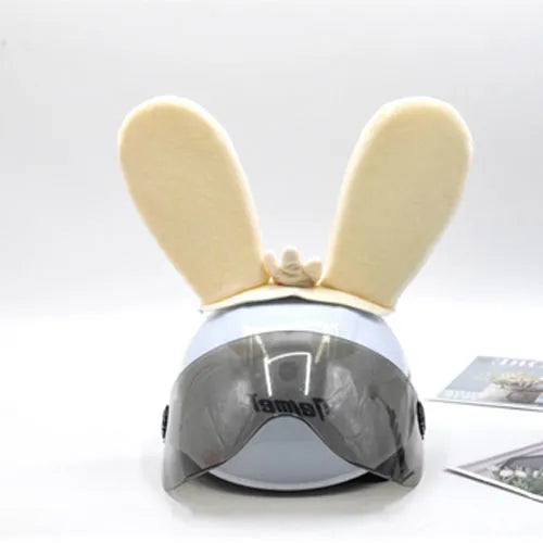 Rabbit Glow helmet decoration with Velcro bottom on a ski helmet, shown in blue LED style.