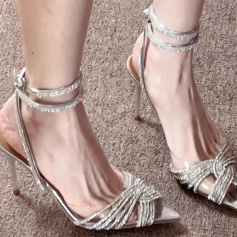 Silver transparent cross rhinestone pointed high heels 8cm with slingback strap on display
