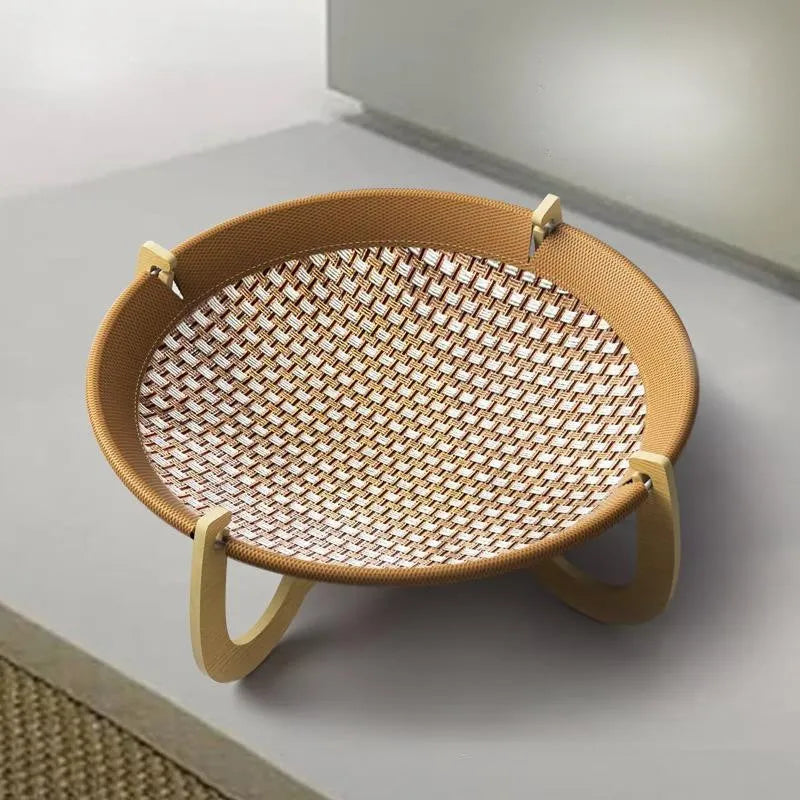 Brown woven rattan off-ground hammock bed for cats and small dogs.