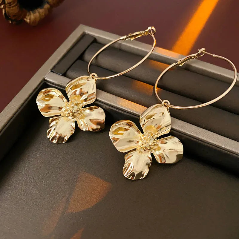 Vintage silver and gold metal flower earrings with geometric shapes and electroplated finish.