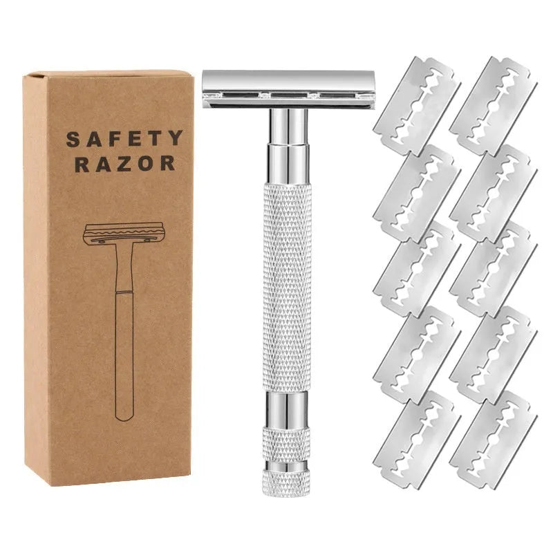 Manual double-sided safety razor with alloy handle, shown with replacement blades on a towel.