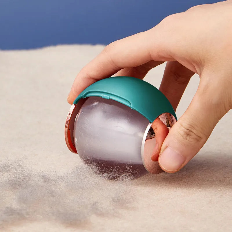 Green gold reusable gel lint roller ball for removing pet hair and lint from fabrics.
