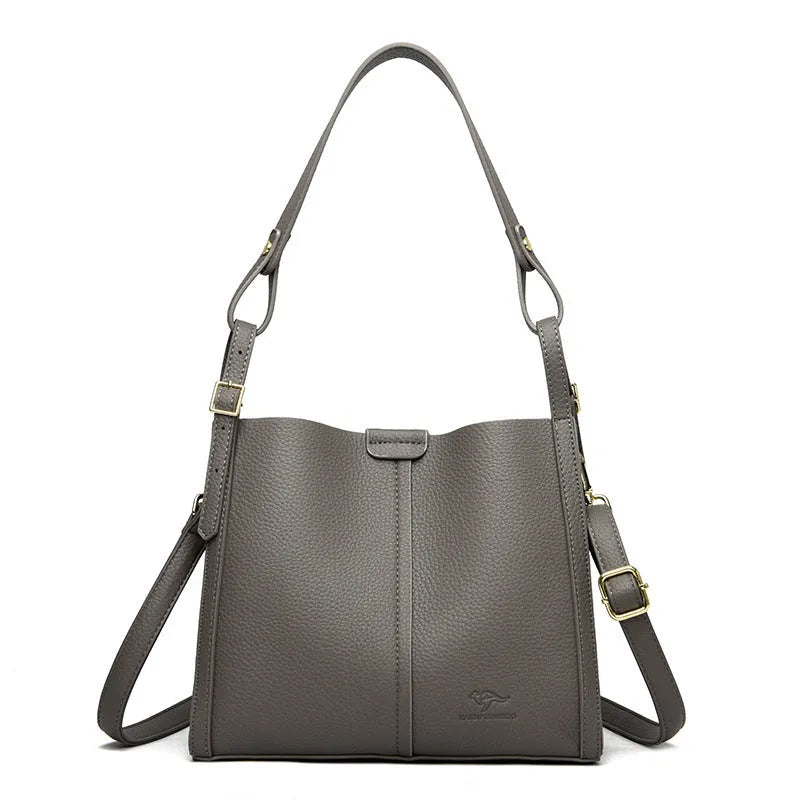 Brown retro ladies shoulder bag with zip compartments showing vertical square shape and single strap