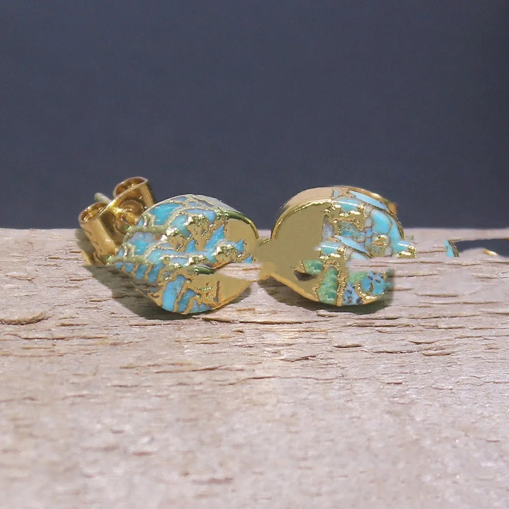 Close-up of handcrafted bohemian stud earrings with an irregular natural stone in colour ER1031 on a simple metal setting.