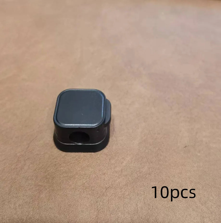 Magnetic cable management clips in white and black with adhesive backing