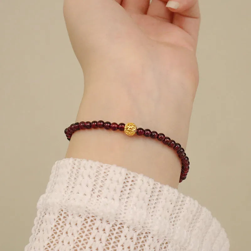 Chinese style gourd bracelet with imitation garnet stones and cultural motifs including Fu character design