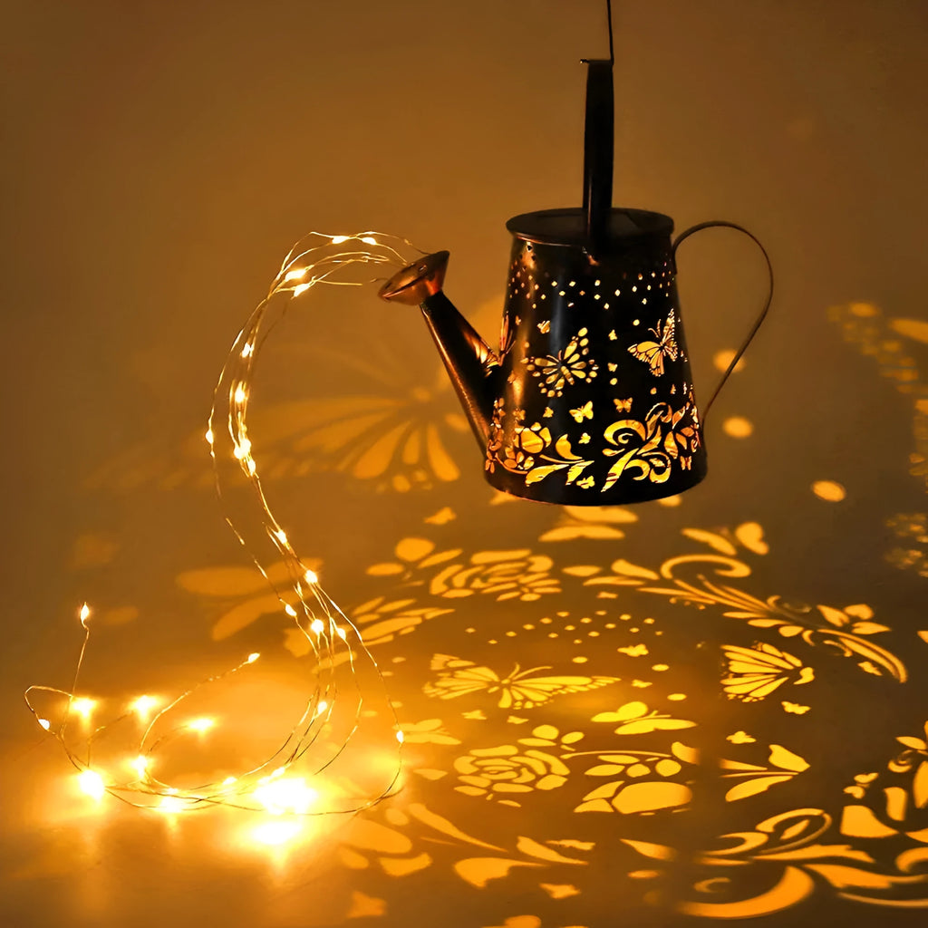 Solar garden lamp with tapered butterfly pattern iron frame and white LED light