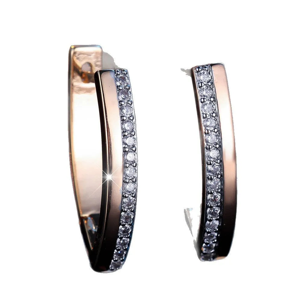 Women's V-shaped electroplated copper ear clips in Champagne Gold and White Diamond geometric design
