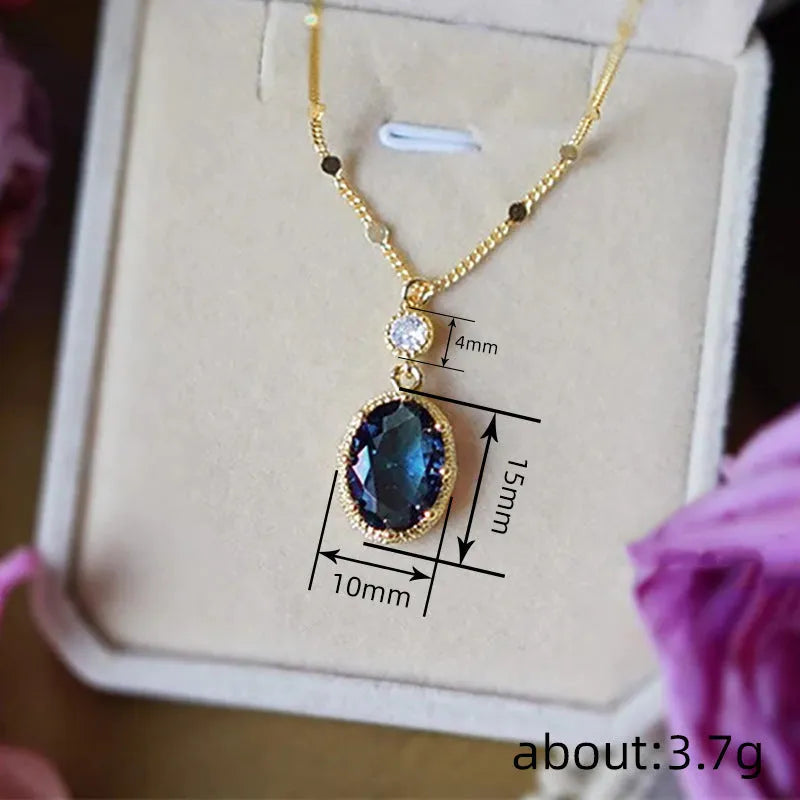 Gold-coloured geometric pendant necklace with a French retro design on a chain.