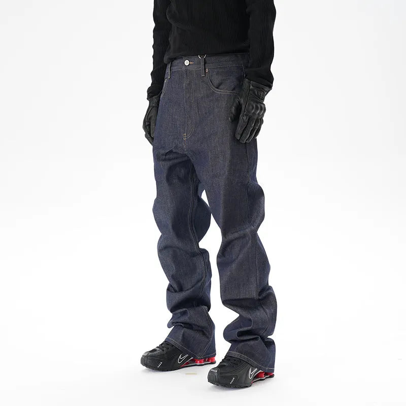 Man's dark blue loose-fit straight leg denim jeans on a neutral background.