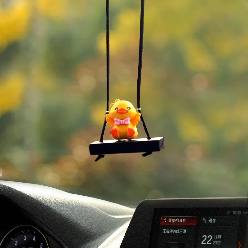 Yellow plastic duck doll car hanging ornament showing four style options: bath towel, swimming ring, bath bucket, and bow.
