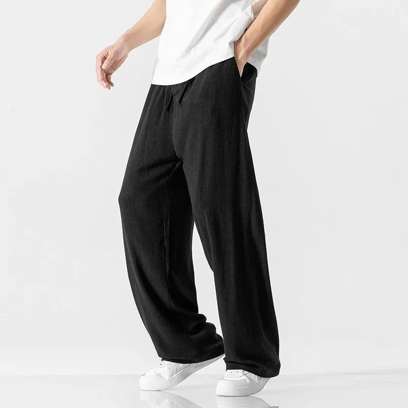 Men's straight-leg casual trousers in beige bamboo fibre fabric with a drawstring waist.