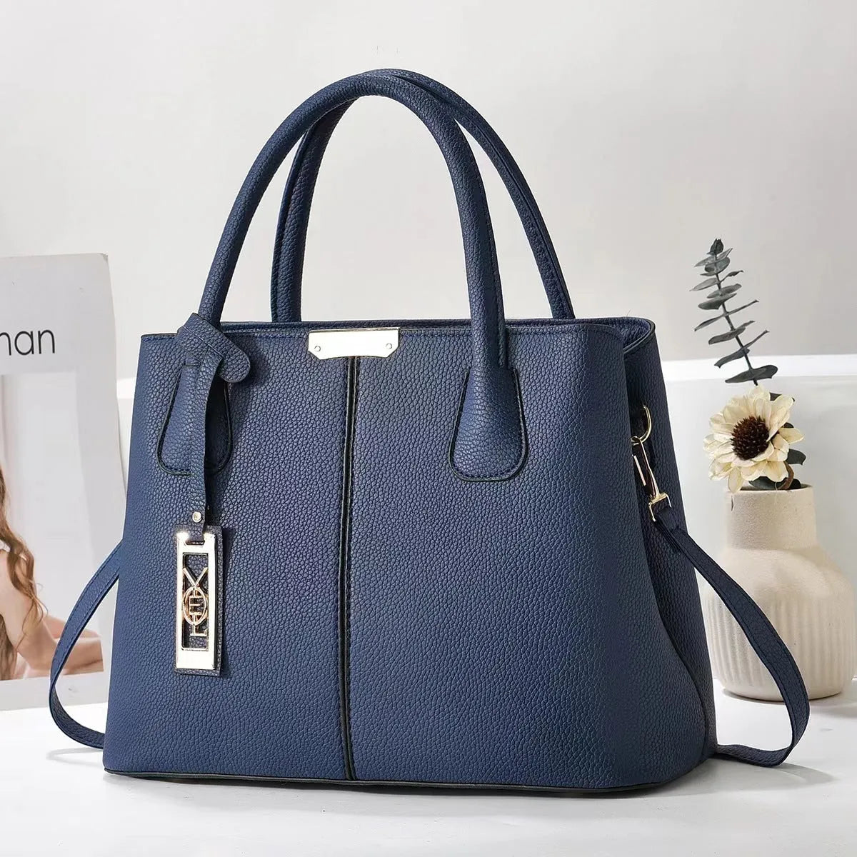 Women's large capacity shoulder bag in soft PU leather with adjustable strap and multiple colour options