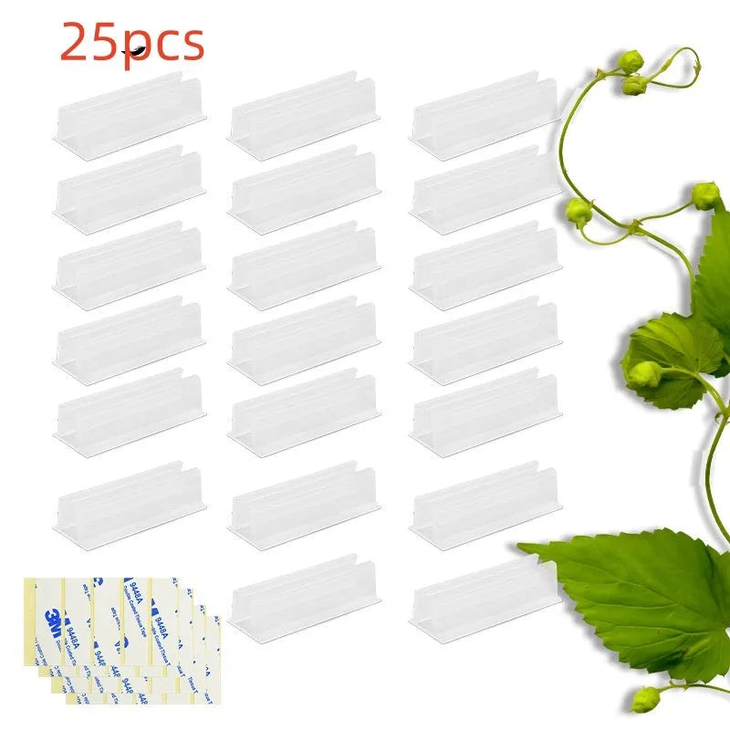 Set of sticky plastic wall-mounted brackets holding data cables on a white wall in a bedroom