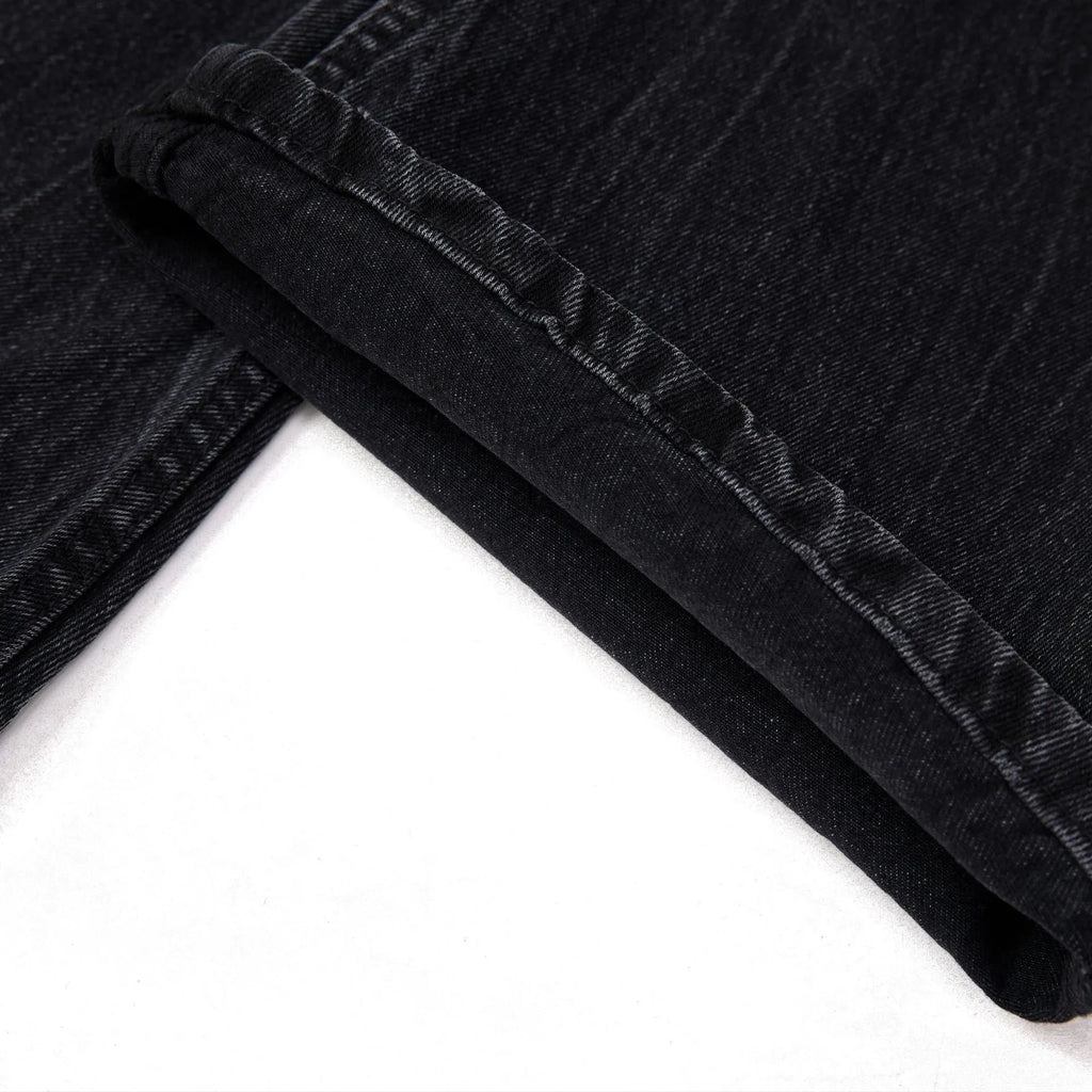 Men's black straight-leg jeans with lightning crack pattern on American washed denim