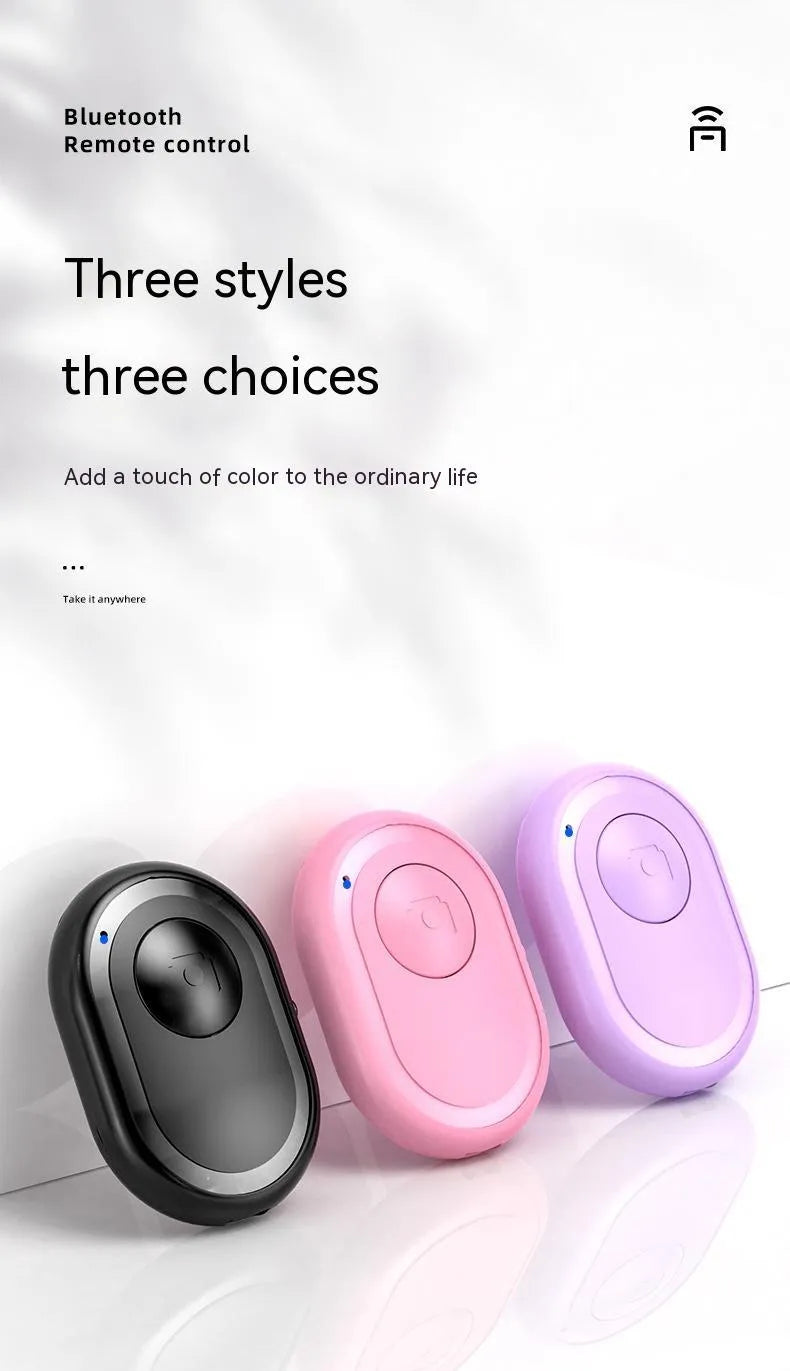 Wireless Bluetooth photo remote control in black, pink, or purple colours showing compact size