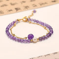Close-up of an amethyst coloured Chinese style bracelet for women, featuring electroplated diamond-shaped crystals.