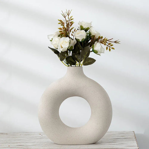 Unglazed porcelain biscuit vase with frosted particle surface in neutral colour