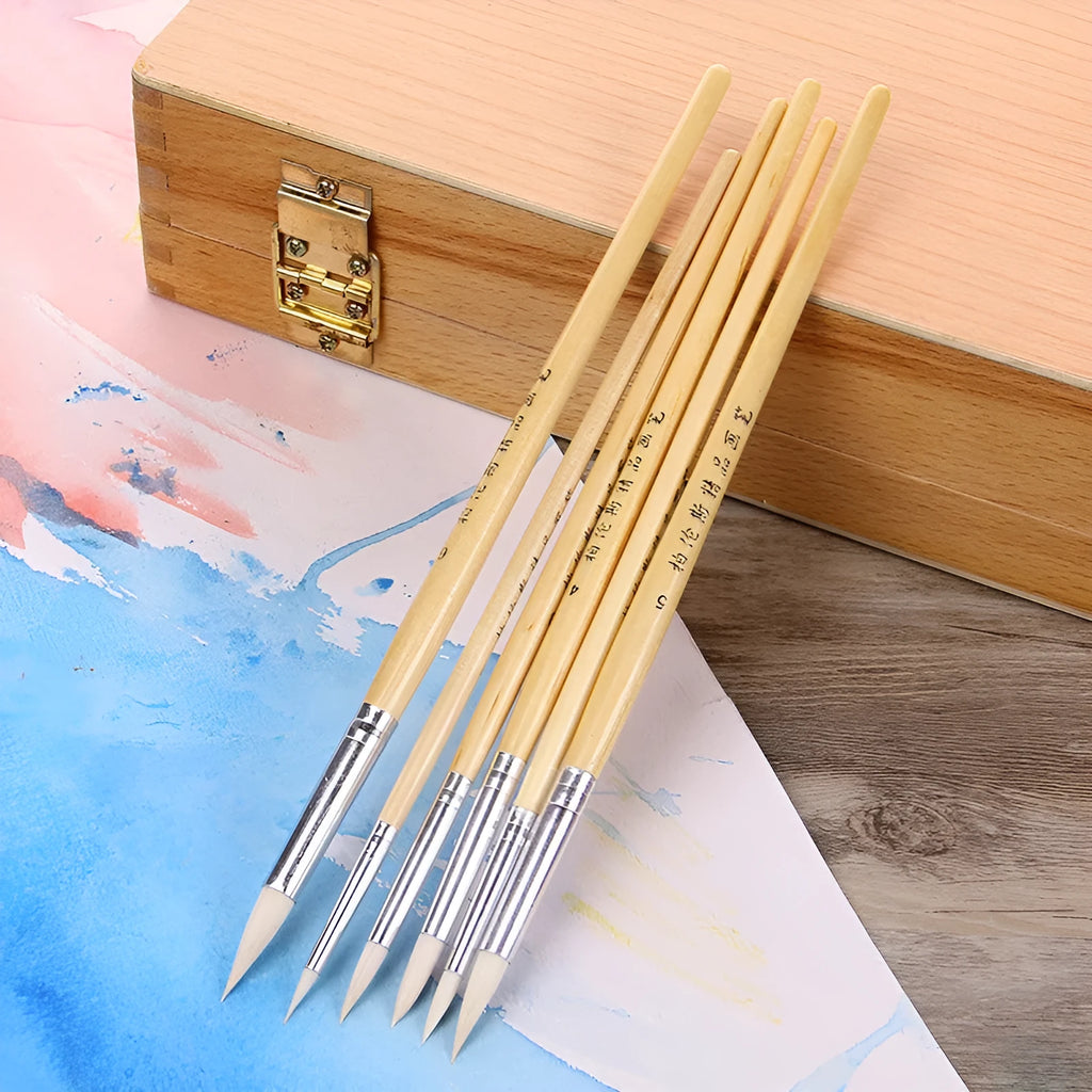 Six wooden hook line pen brushes with wool pointed tips arranged together