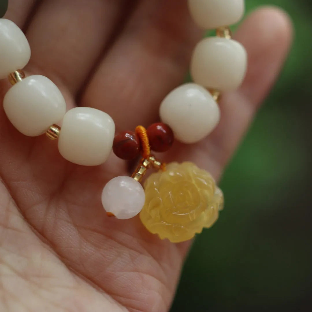 Gradient white jade Bodhi root bracelet with natural beeswax lotus charms, 10mm flower shape