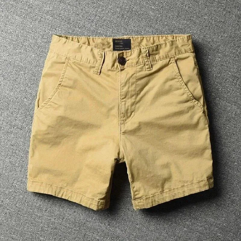 Men's cotton loose shorts in straight-leg cut with zipper fly, shown in multiple colour options including camouflage patterns
