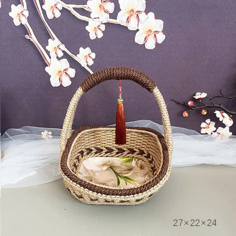 Hand-woven hemp rope basket in natural brown colour measuring 19cm high by 12cm wide