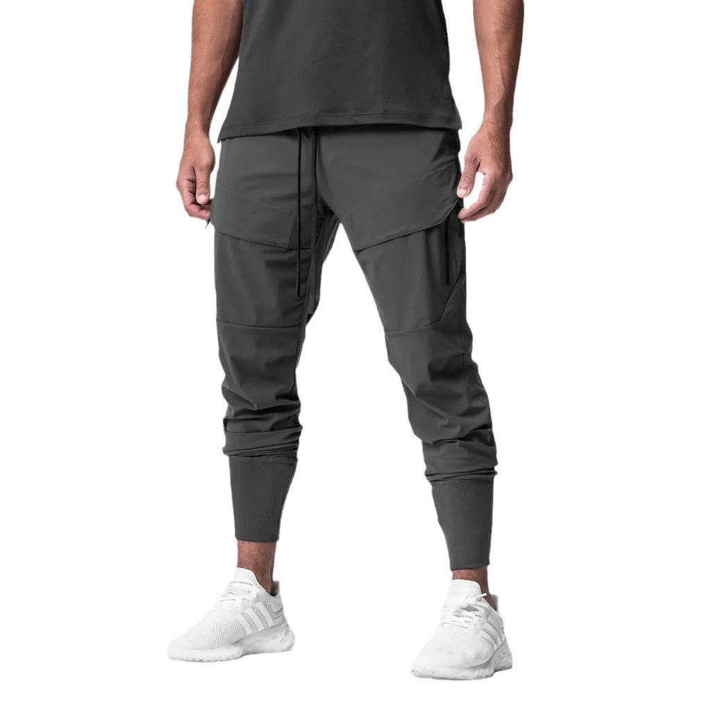 Men's solid colour polyester jogger pants in black, mid-waist style, casual sports trousers