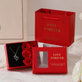 Korean style red gift box containing six pink soap flowers, with a matching handbag.