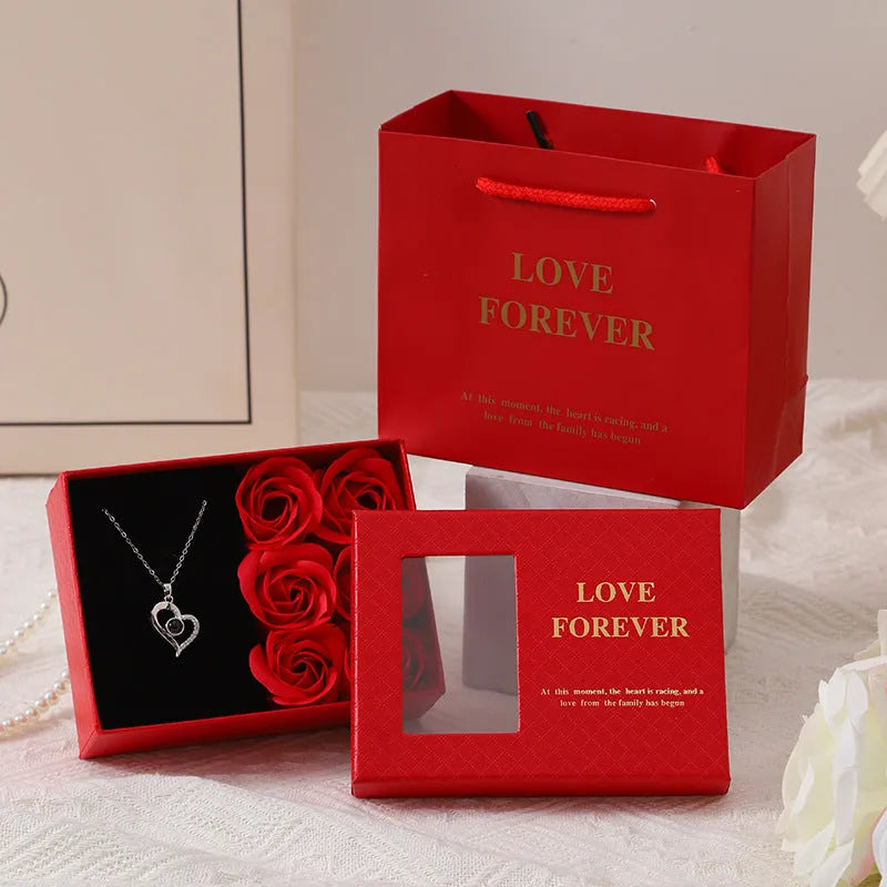 Korean style red gift box containing six pink soap flowers, with a matching handbag.