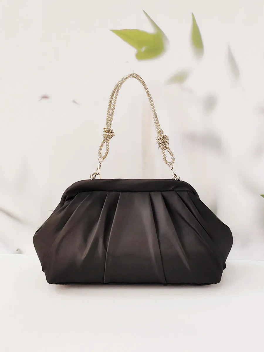 Women's black polyester messenger bag with chain detail, diamond patterns, and document organiser compartment