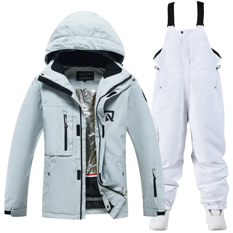 Man and woman modelling a blue and black waterproof ski suit for winter snow sports.