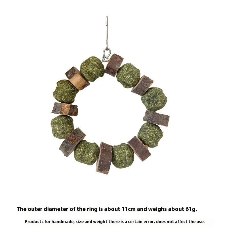 Hamster chew toy featuring applewood sticks and decorative straw balls with colourful sequins