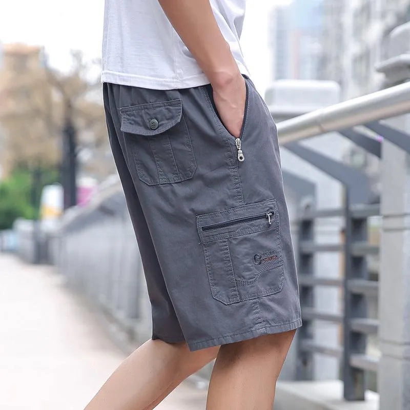 Men's straight-leg cotton trousers in army green colour showing loose fit and summer design