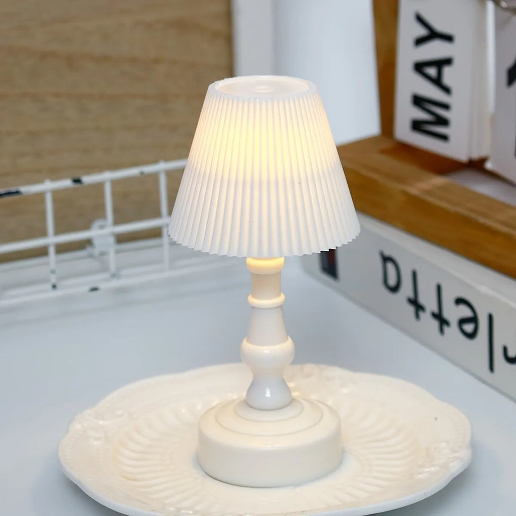 Battery-powered decorative table lamp with LED light, white pleated shade