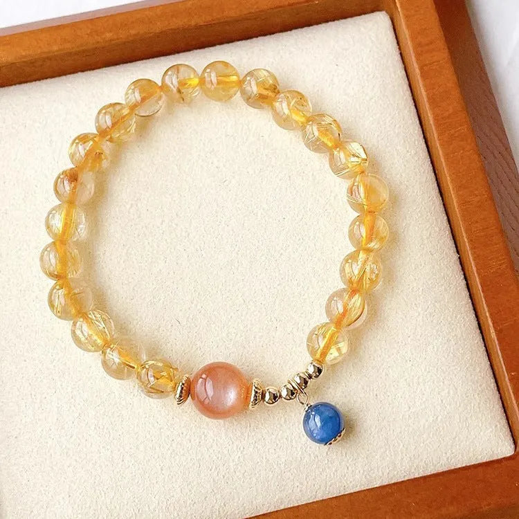 Women's gold rutilated quartz sunstone crystal bracelet with diamond beads